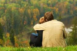 sweet-couple-sitting-on-a-hill-250.jpg